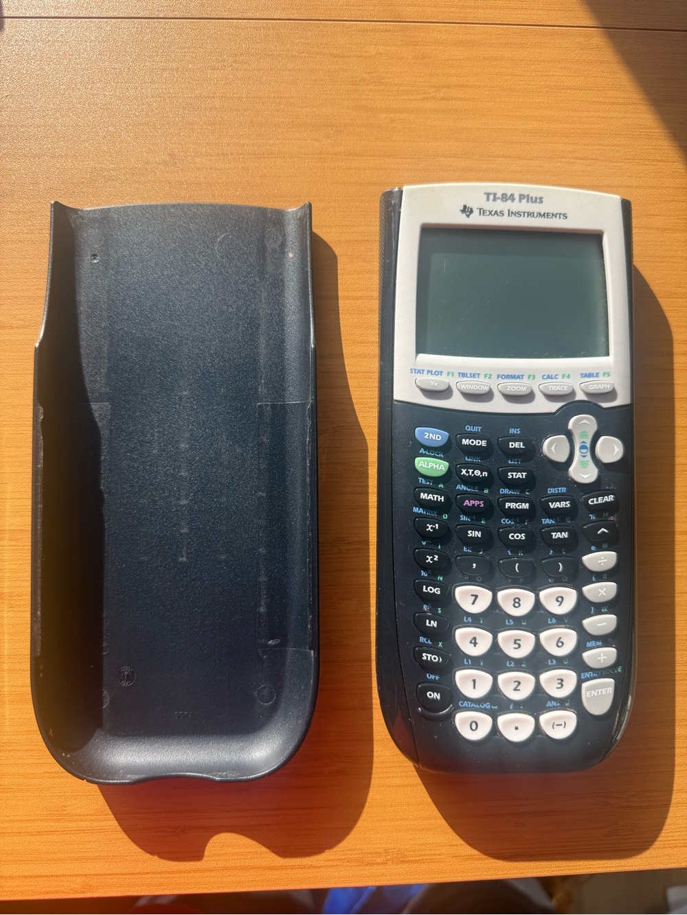 Texas Instruments TI-84 Plus Graphing Calculator in Black and White